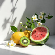 Kiwi, watermelon and lemon representing the olfactory notes of the perfume.