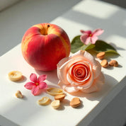 A peach and a rose representing the olfactory notes of the perfume. 