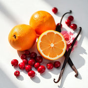 Oranges and red berries representing the olfactory notes of the perfume.