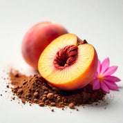 Peach and a freesia on cocoa beans representing the olfactory notes of the perfume.