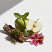 Green apple, moss and cedar representing the olfactory notes of the perfume.