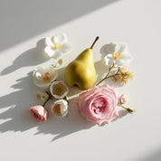 Pear and rose represent the olfactory notes of the perfume.